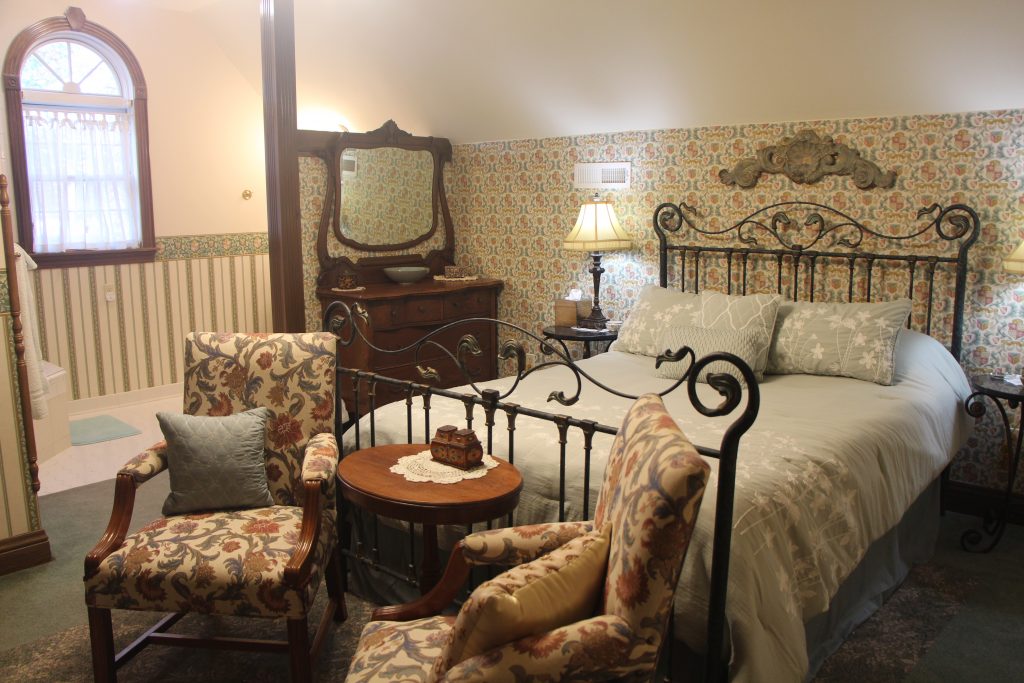 Merlin's Camelot Room. Bed, sitting area, dresser, tables.