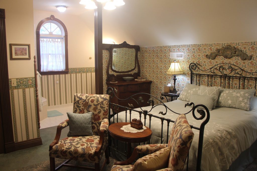 Merlin's Camelot Room. Bed, sitting area, dresser.