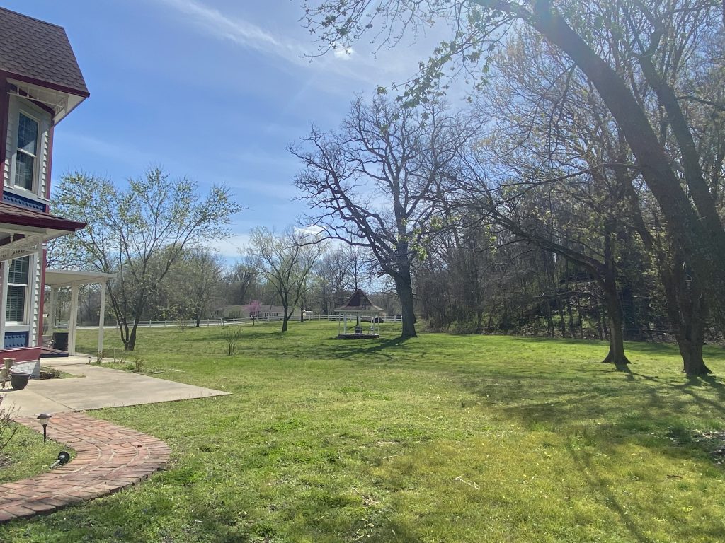 looking out into the grounds with the gazebo and lots of trees